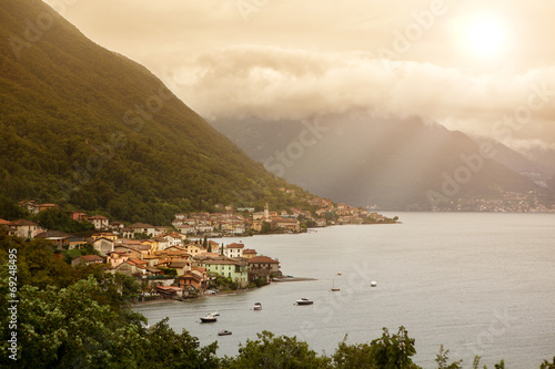 Fototapeta View of italian village on Como lake in sunlight
