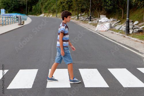 Teenager through a zebra crossing