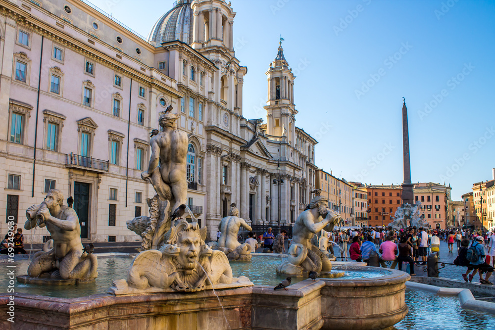 Tourist in Navona square near the Moor Fountain , in Rome, Italy