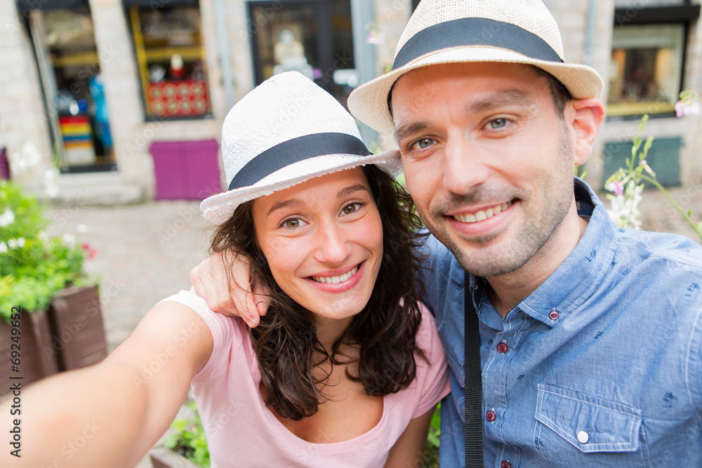 Young couple on holidays taking selfie Young couple on holidays taking selfie