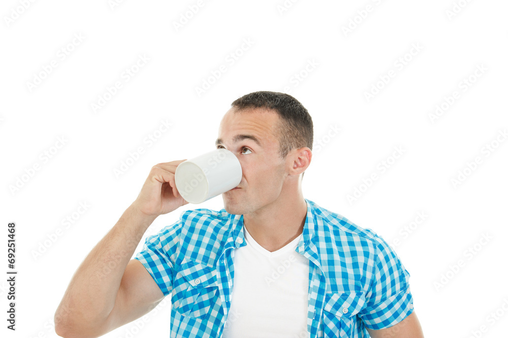 Young muscular guy drinking coffee or tea enjoying it Young muscular guy drinking coffee or tea enjoying it