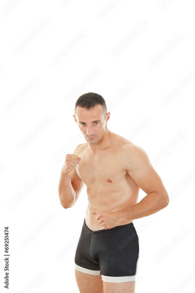 Young muscular sports guy with naked torso boxing Young muscular sports guy with naked torso boxing