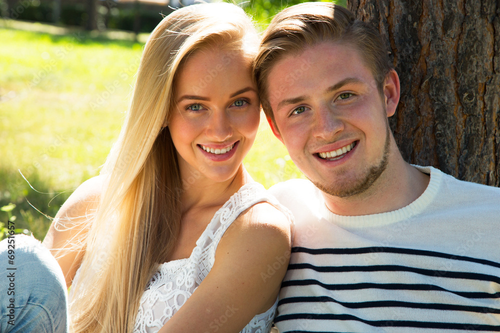 Portrait of a happy couple laughing at camera Portrait of a happy couple laughing at camera