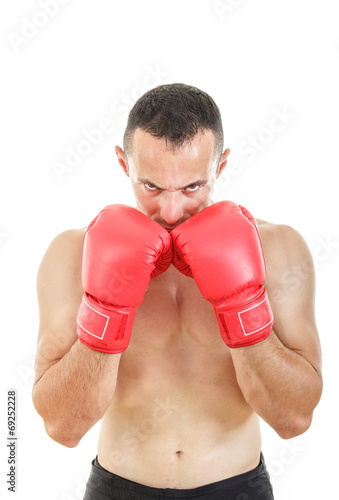 muscular man with connected red boxing gloves near his face