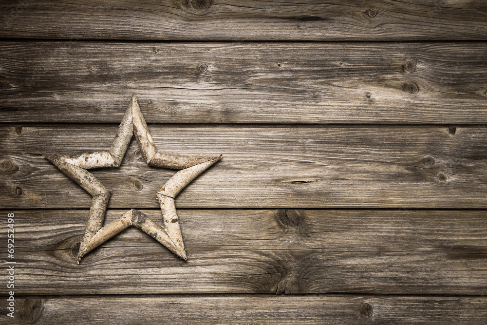 Weihnachtlicher Holz Hintergrund mit Stern Weihnachtlicher Holz Hintergrund mit Stern
