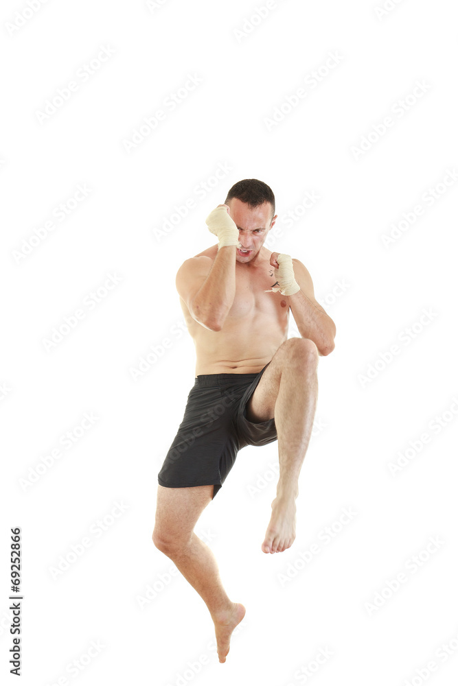 athletic fighter with bandages on hands jumping athletic fighter with bandages on hands jumping