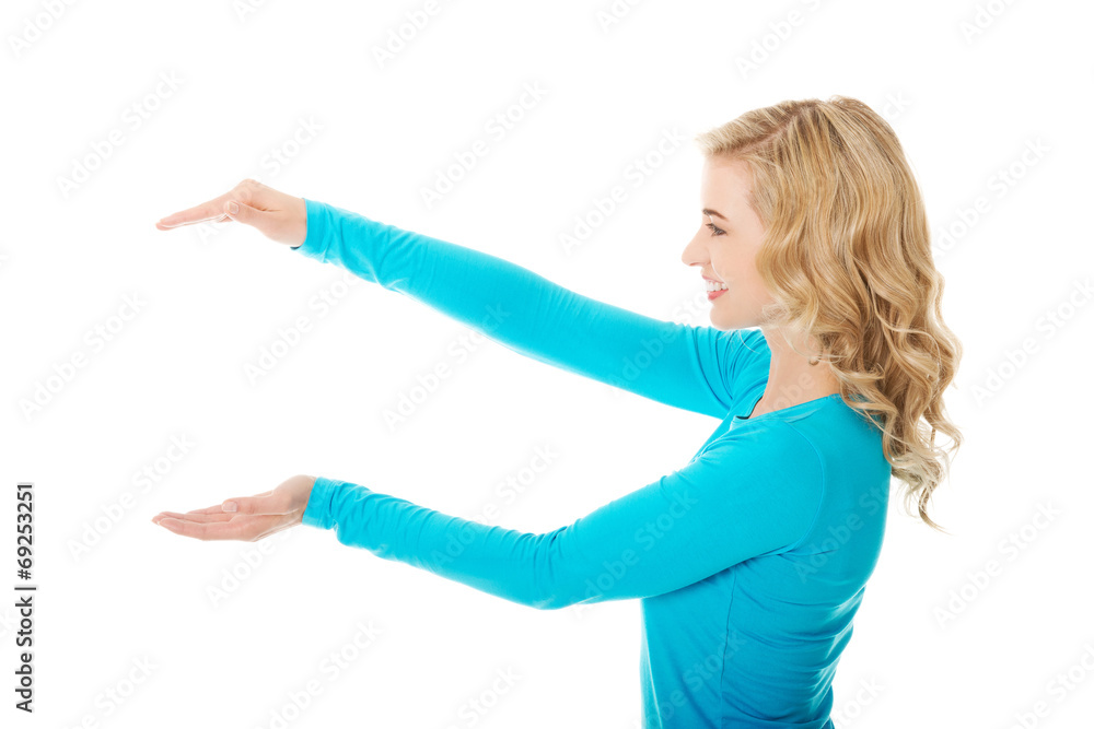 Woman showing something or copyspase Woman showing something or copyspase
