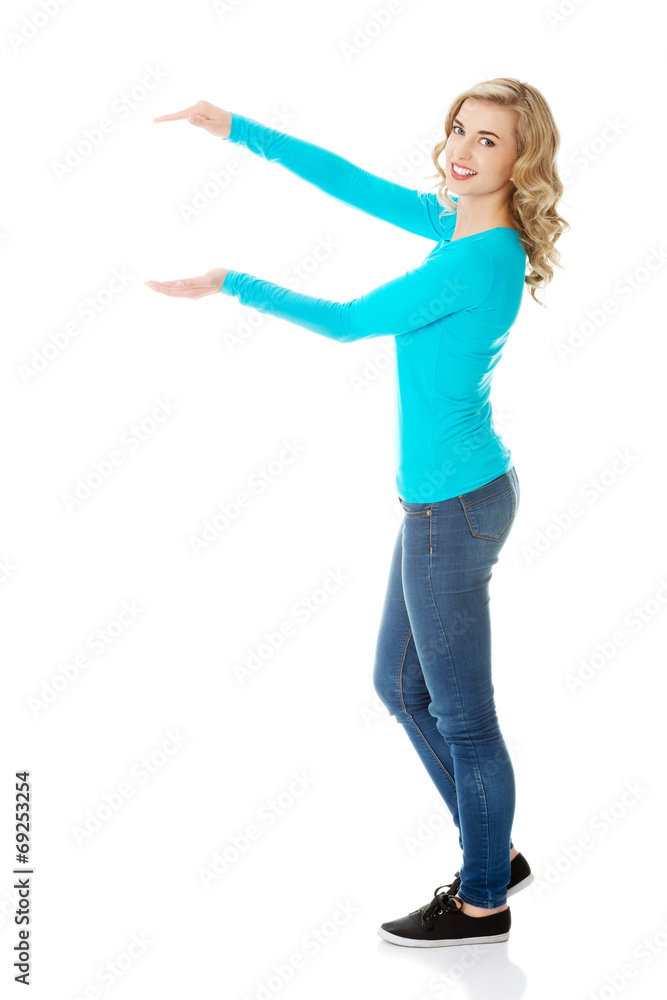 Woman showing something or copyspase Woman showing something or copyspase