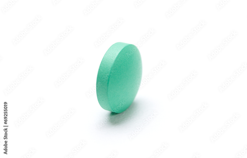 Green pill, isolated on white. Healthcare concept. Green pill, isolated on white. Healthcare concept.