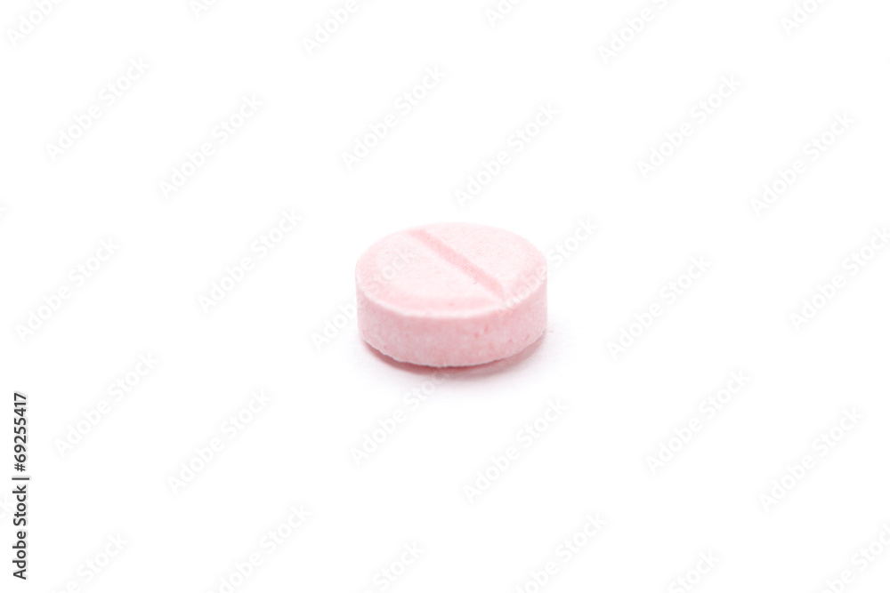 Pink vitamin on white background. Healthcare concept. Pink vitamin on white background. Healthcare concept.