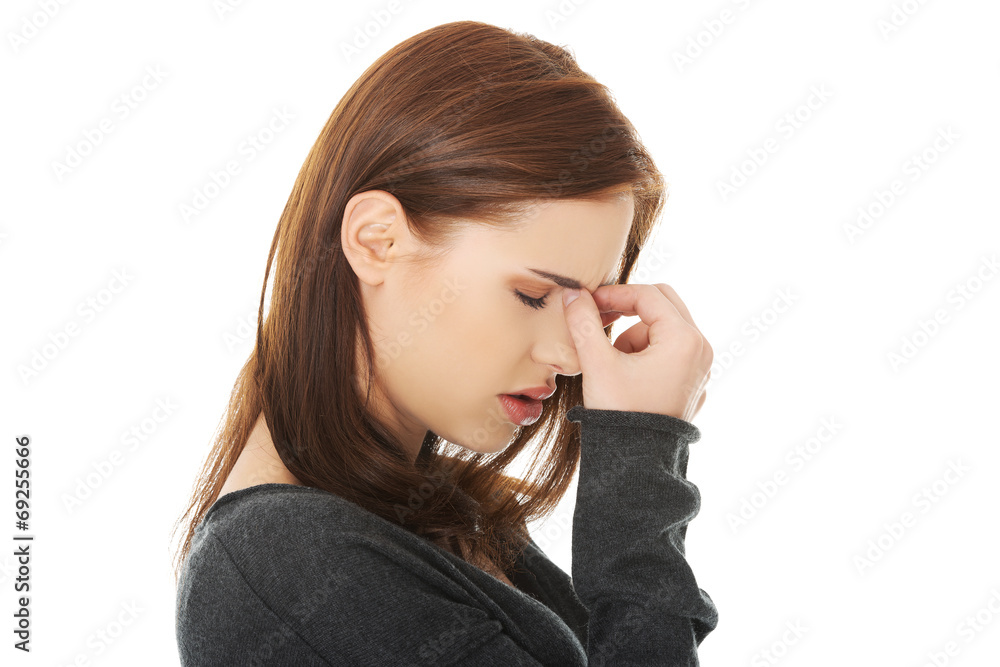 Woman with sinus pressure pain Woman with sinus pressure pain