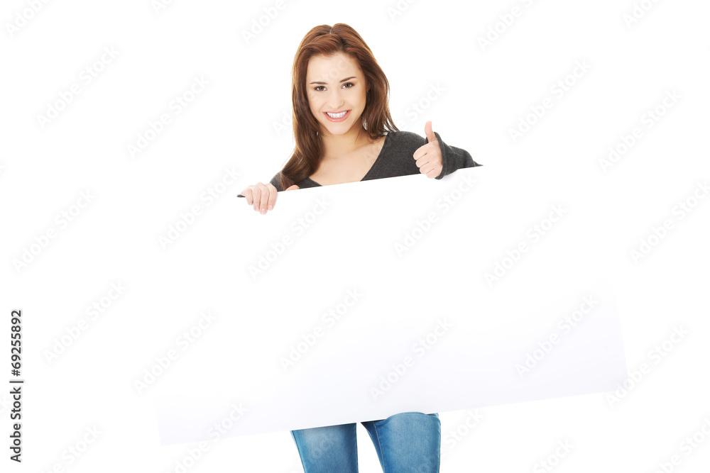 Portrait of happy woman with blank board Portrait of happy woman with blank board