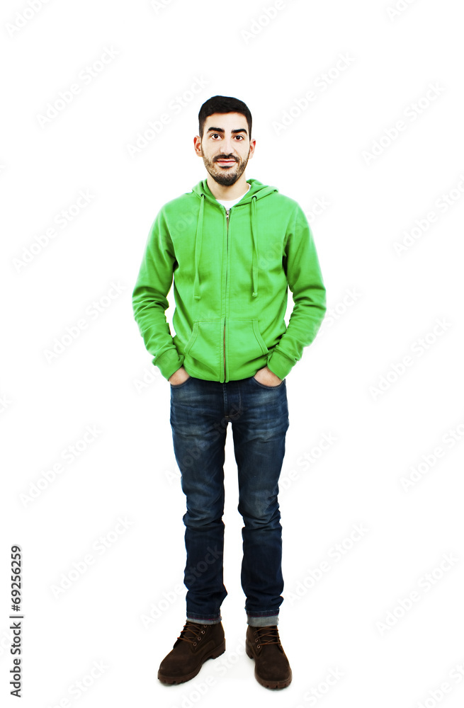 Young man standing with hands in pockets Young man standing with hands in pockets