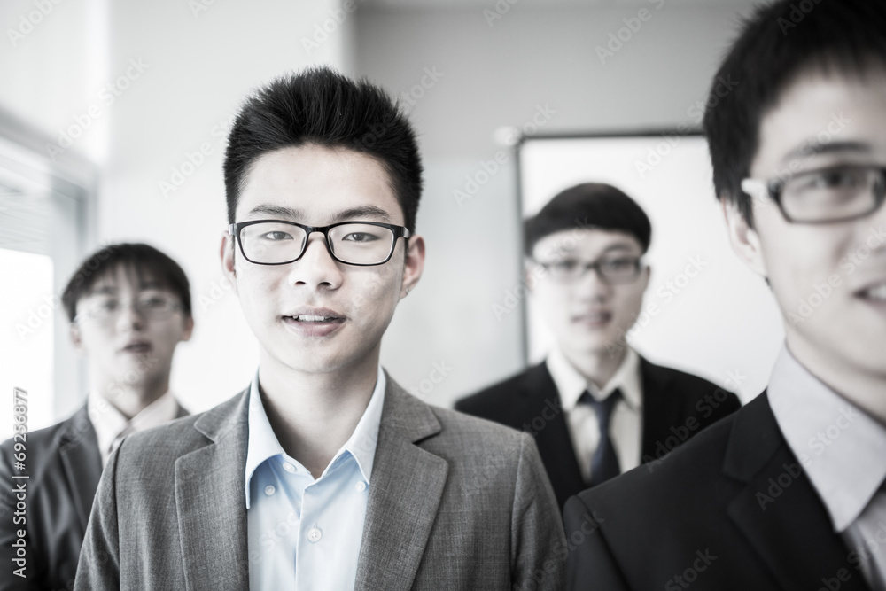 Group of business people with businessman leader on foreground Group of business people with businessman leader on foreground