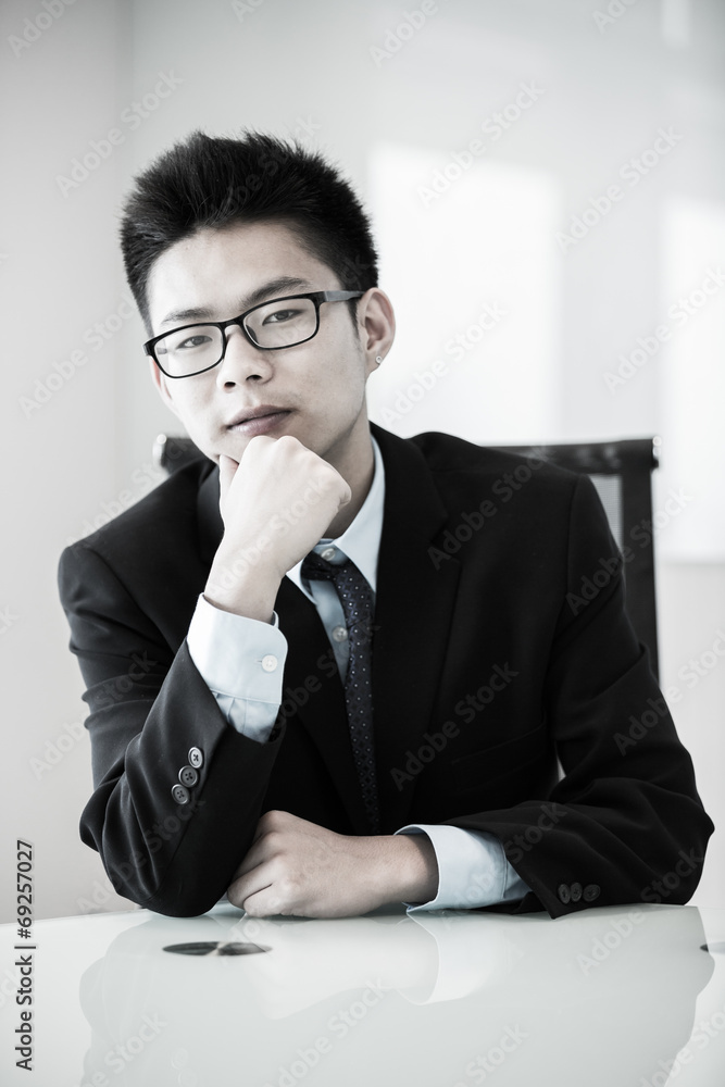 Image of young handsome confident businessman in suit Image of young handsome confident businessman in suit
