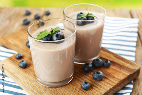 Delicious berry mousse in glasses on table close-up