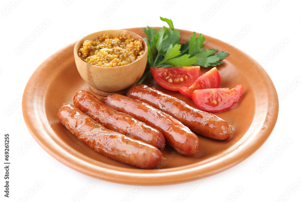 Tasty thin sausages on plate isolated on white Tasty thin sausages on plate isolated on white