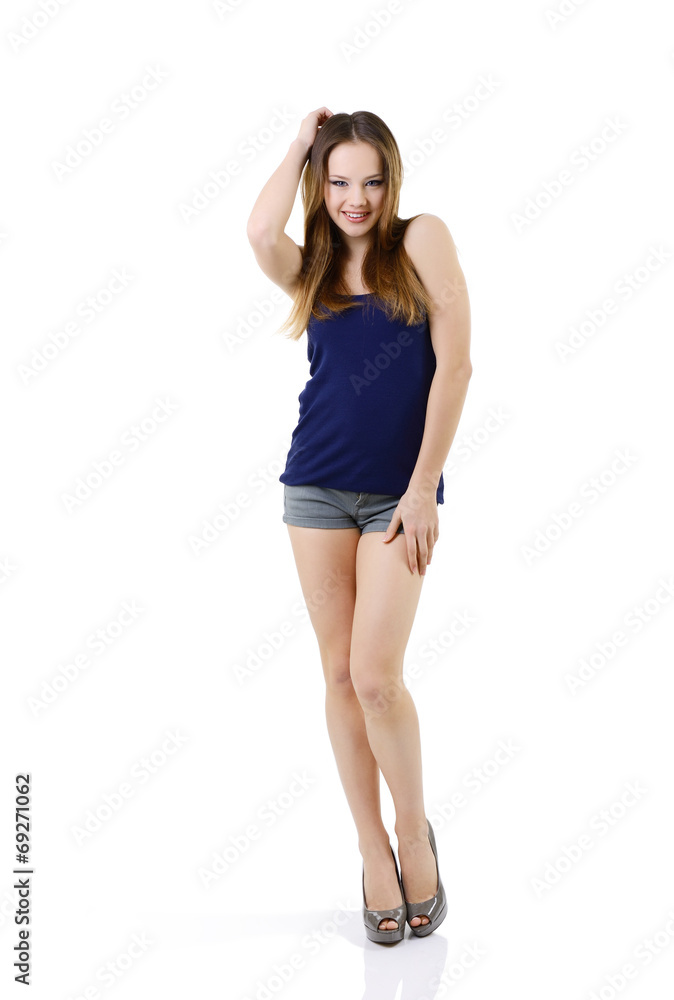attractive happy teen girl in blue t-shirt, full length portrait attractive happy teen girl in blue t-shirt, full length portrait