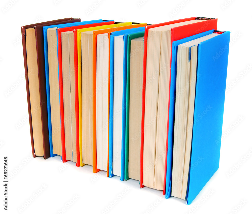 Multi-coloured books. On white background. Multi-coloured books. On white background.