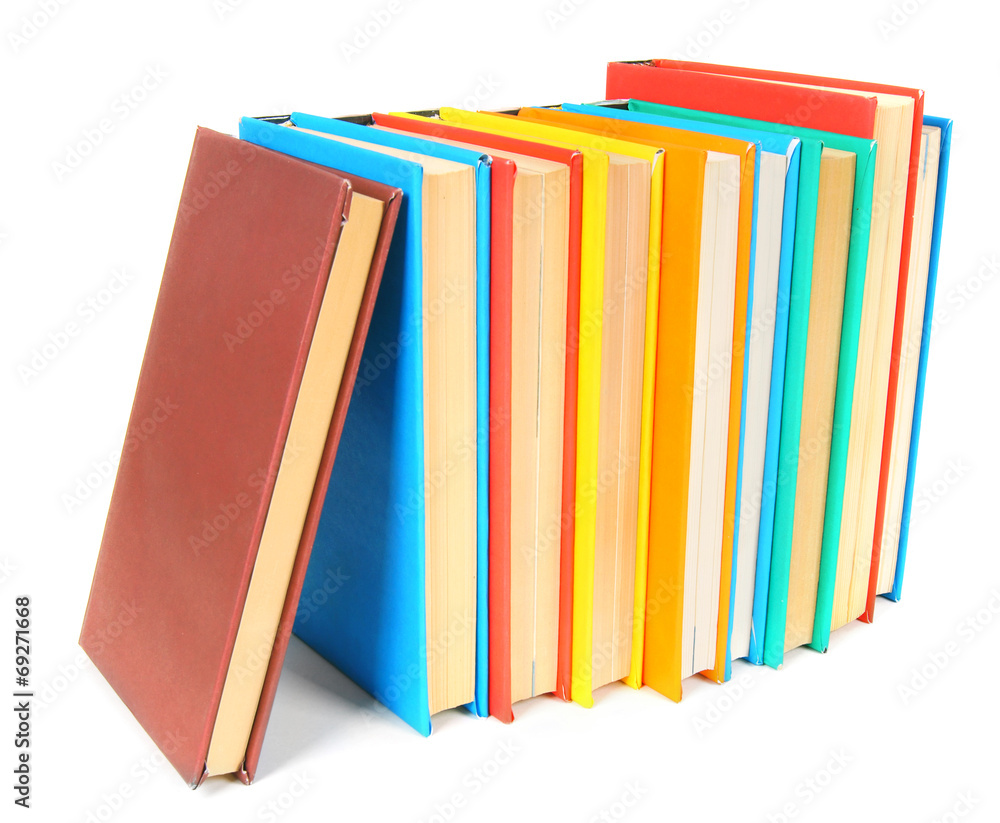 Multi-coloured books. On white background. Multi-coloured books. On white background.