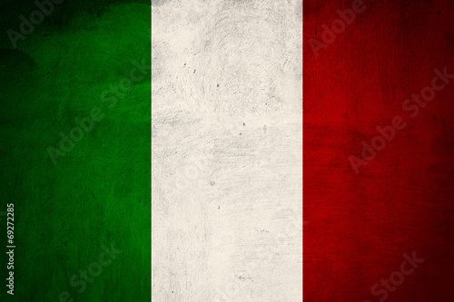 Italian flag printed on grunge concrete wall, national italian b