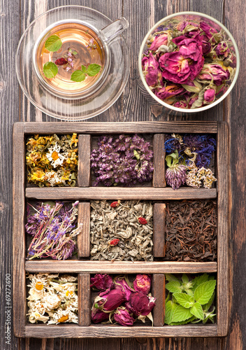 Dried Herbs and flowers  in vintage box and herbal tea