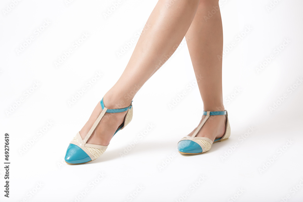 Woman's Legs Wearing Turquoise Shoes