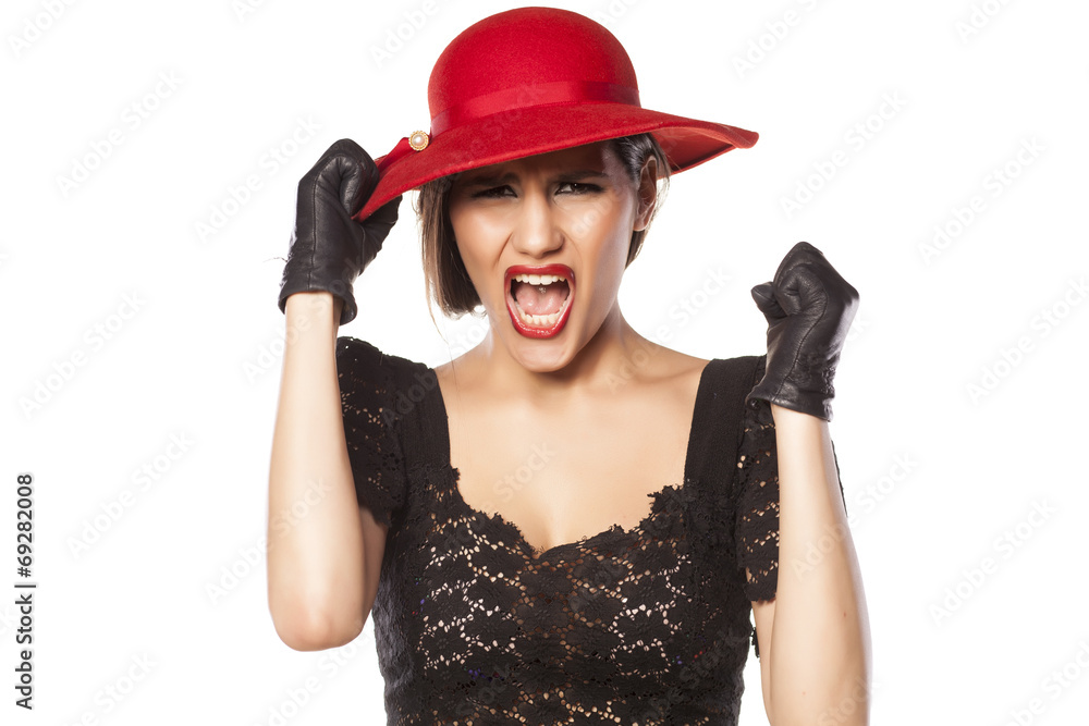 angry woman with a red hat and leather gloves angry woman with a red hat and leather gloves
