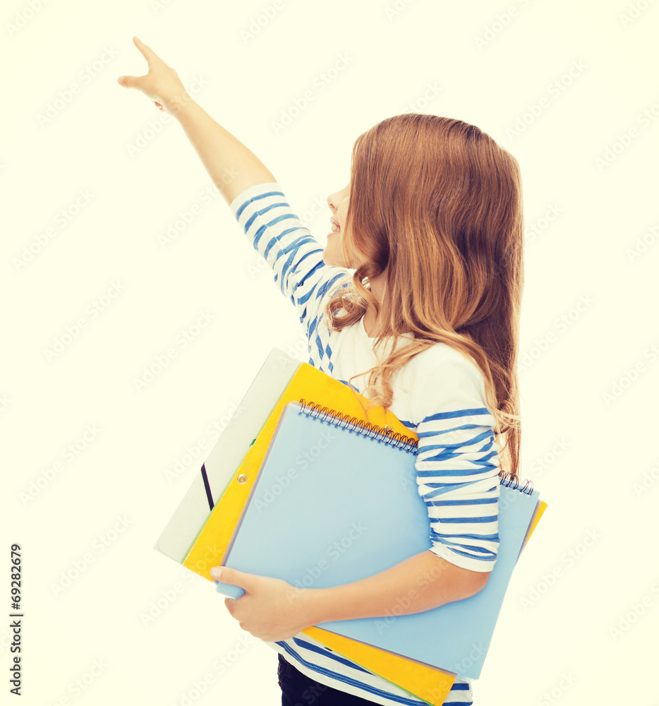 little student girl with notebooks pointing to little student girl with notebooks pointing to