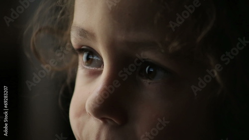 Little boy watching television at home photo