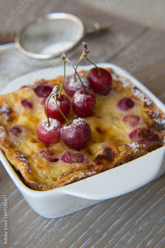 Cherry mini pie in the ceramic baking mould