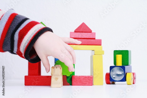 child hands play isolated toy photo