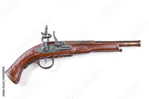 Old wooden gun, upper side, selective focus, on white background