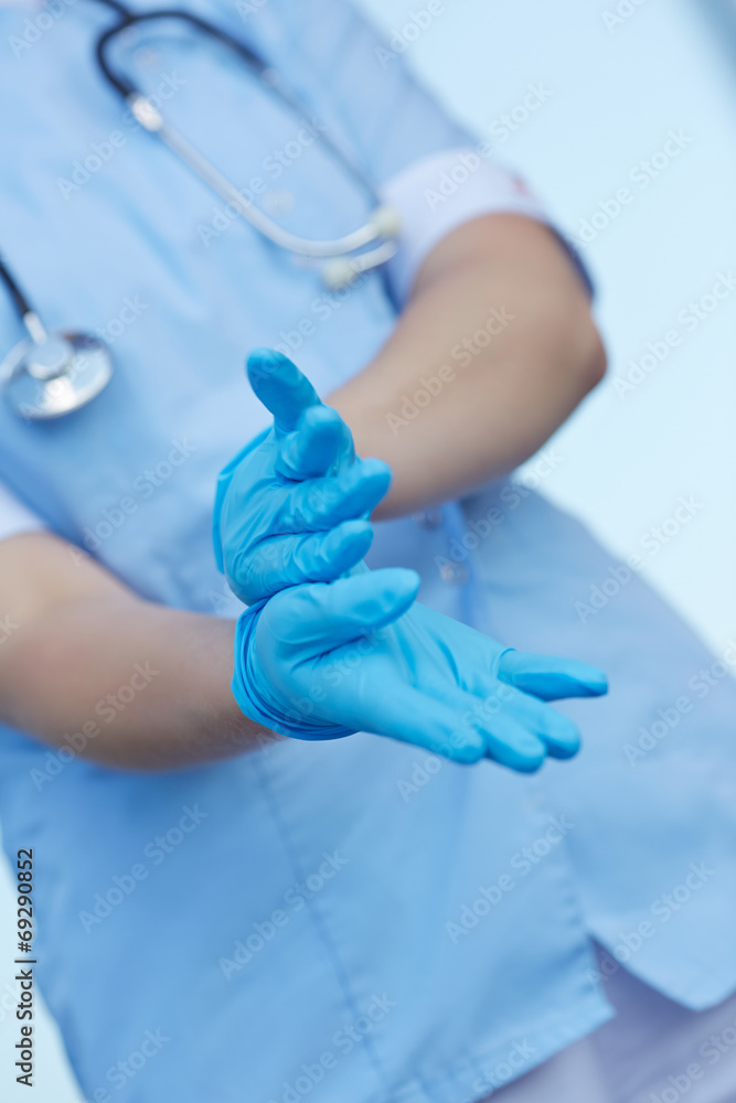 woman doctor wears medical gloves woman doctor wears medical gloves