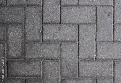 Paved walkway made from concrete blocks usable as background or texture
