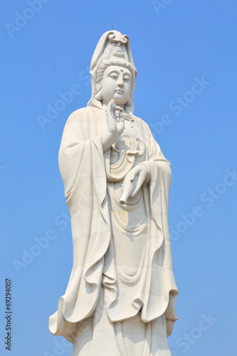 Big Standing Guan Yin on blue sky