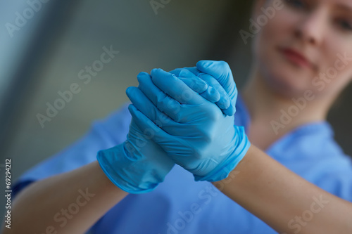 female doctor in medical gloves