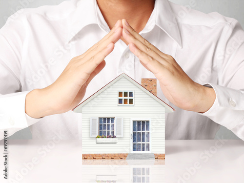 begin for mortgage concept, holding a house 