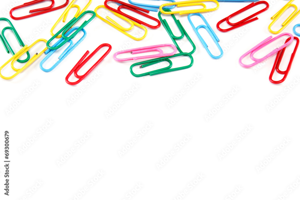 Colored paper clips on white background. Colored paper clips on white background.