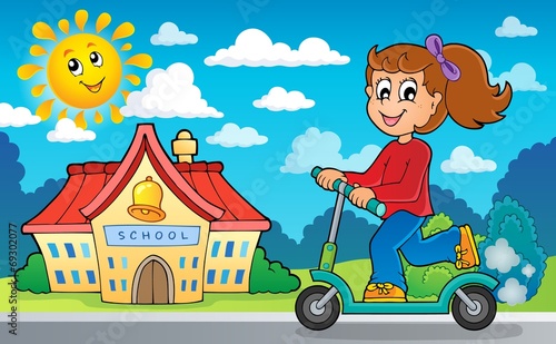 Girl on push scooter near school
