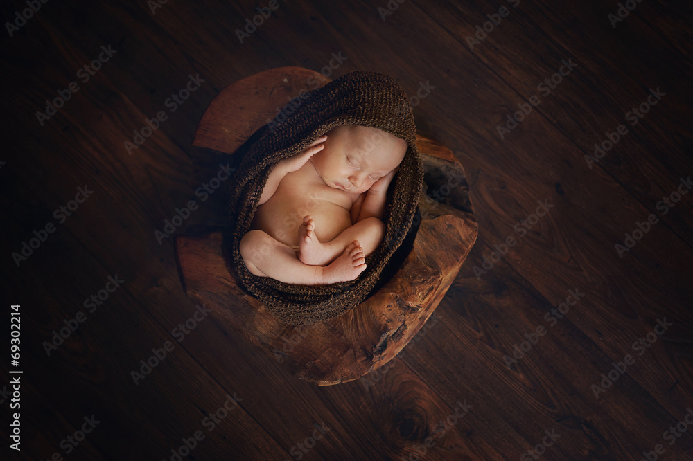 Sleeping Newborn Baby in Basket or wooden bowl