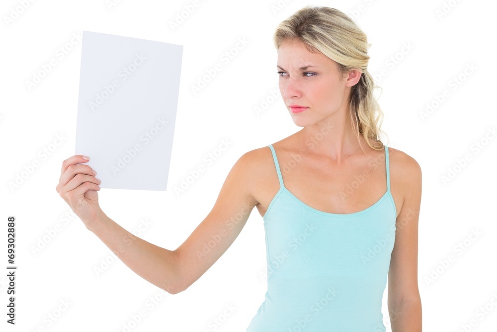 Angry blonde holding a sheet of paper Angry blonde holding a sheet of paper