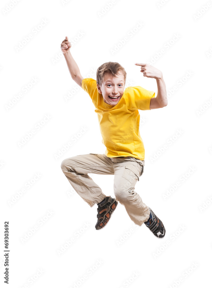 Funny child jumping and laughing pointing with his index finger