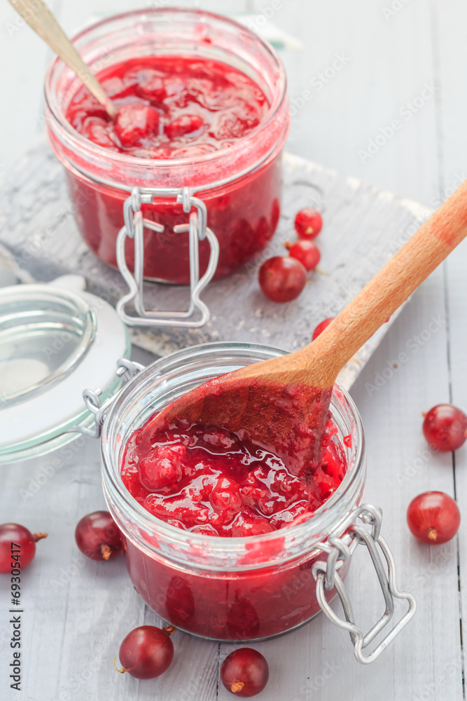 Jars gooseberry jam wooden table