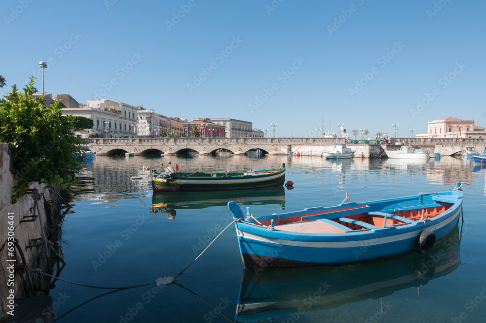 View of Umberto I bridge in Siracuse and fishing boats
