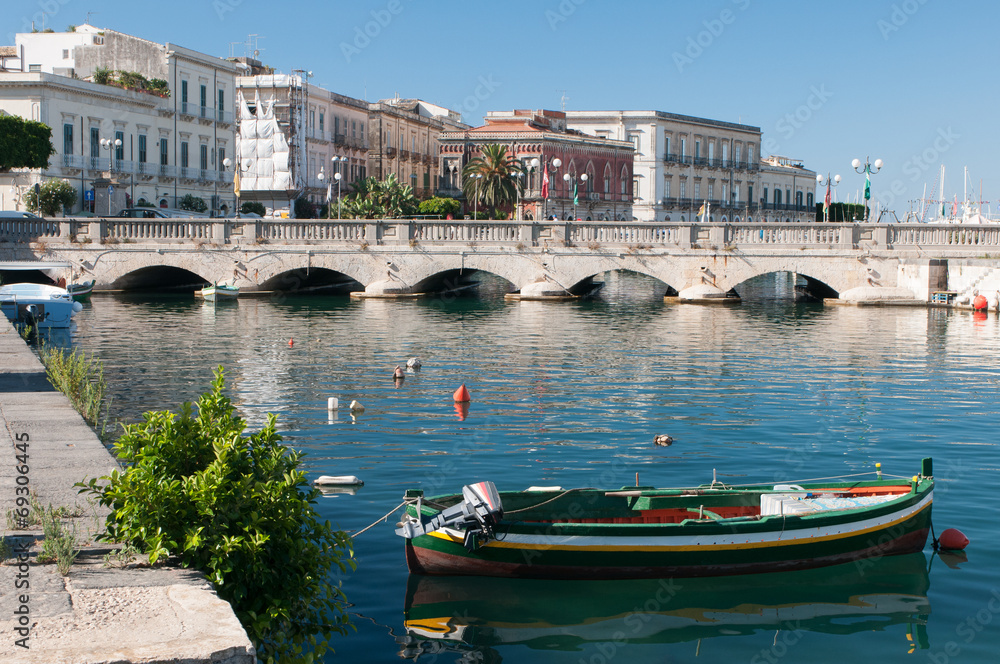View of Umberto I bridge in Siracuse and fishing boats