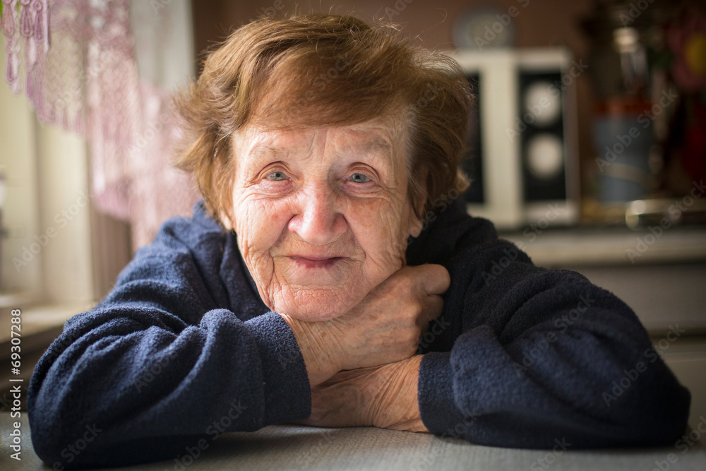 Close-up portrait of an elderly woman in her home. Close-up portrait of an elderly woman in her home.