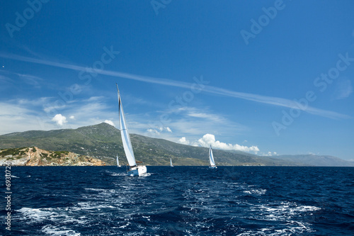 Luxury Yachts. Sailboats participate in sailing regatta.