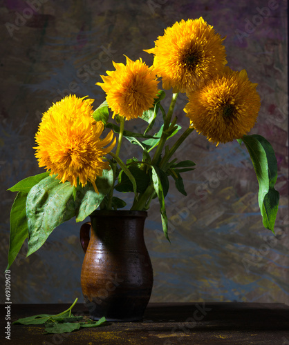 Still life with beautiful sunflowers in vase