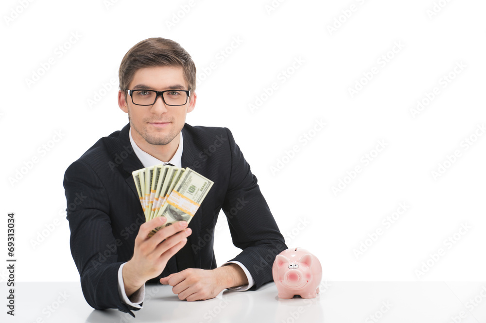Business man holding dollar bills, isolated on white. Business man holding dollar bills, isolated on white.